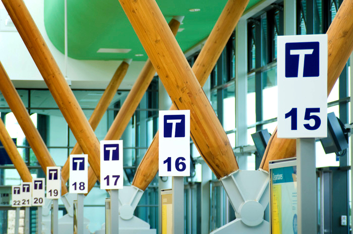 Bus stands at Barnsley interchange showing T logo and numbers of the stands