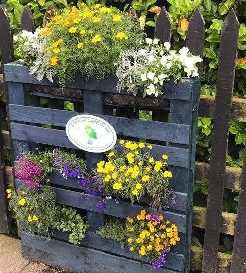Silkstone Common station pallet planter filled with plants and flowers